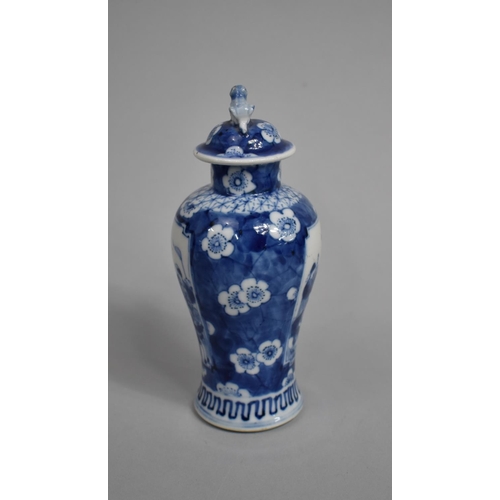 289 - A Small 19th Century Blue and White Baluster Vase and Cover decorated with Figural Cartouches with M... 