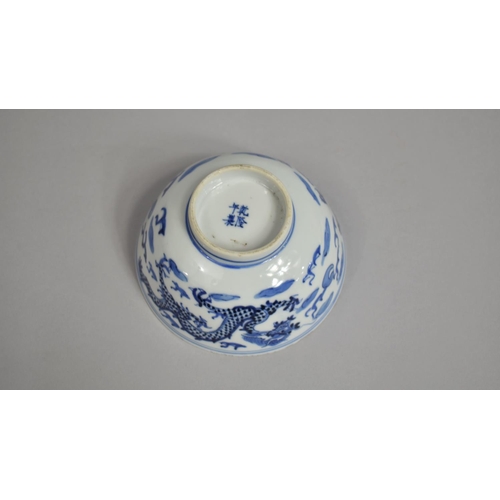 273 - A Chinese Porcelain Blue and White Bowl Decorated with Dragons Chasing Flaming Pearl Amongst Clouds ... 