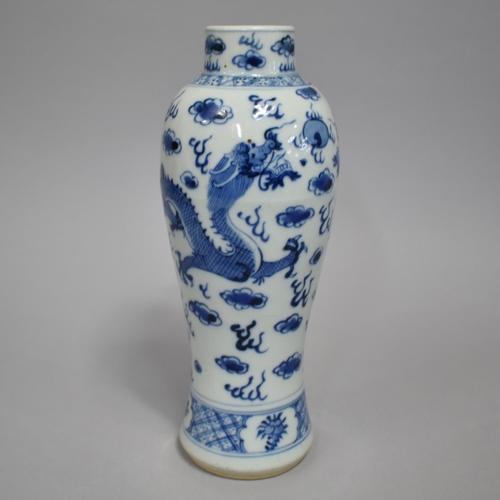 269 - A Chinese Porcelain Blue and White Vase Decorated with Dragon in Clouded and Scrolled Sky, 25cm High