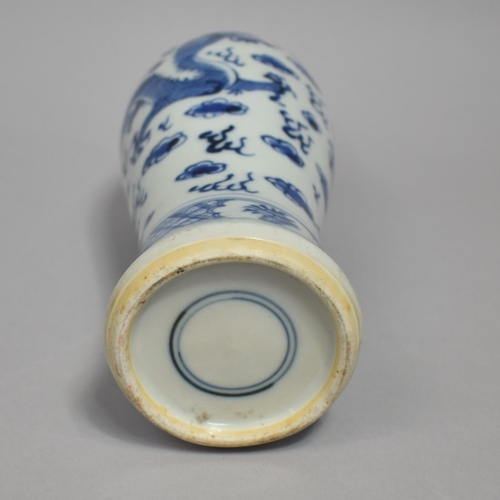 269 - A Chinese Porcelain Blue and White Vase Decorated with Dragon in Clouded and Scrolled Sky, 25cm High