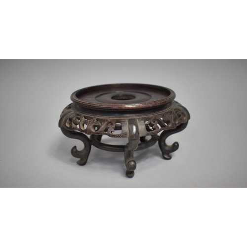 212 - A Chinese Hardwood Carved and Pierced Stand, Raised on Five Scrolled Supports, 11cms High and 20cms ... 