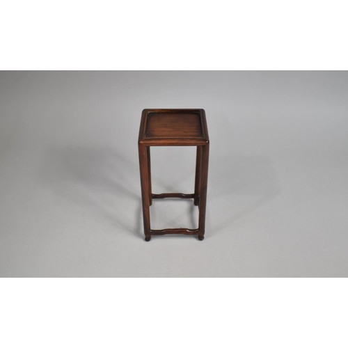 213 - A Tall Chinese Square Topped Wooden Vase Stand, 22cms High and 11cms Square