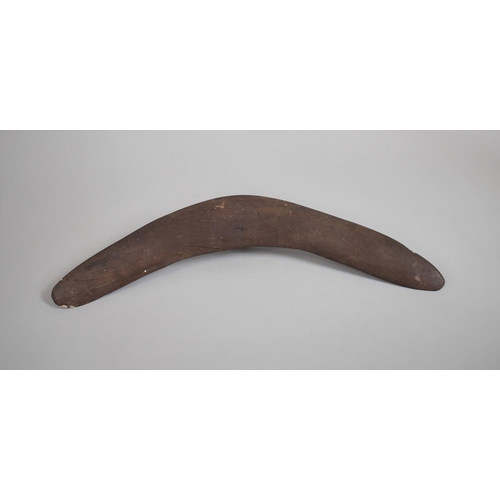 67 - An Aboriginal Carved Wooden Boomerang, 53cms Wide