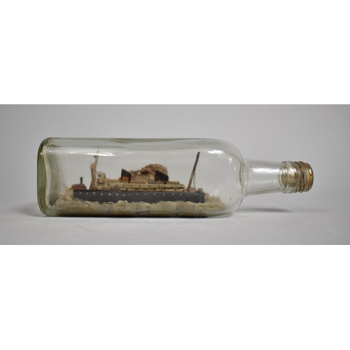 56 - An Early 20th Century Folk Art Ship in a Bottle, Passenger Liner with Light House and Rocky Land, 24... 