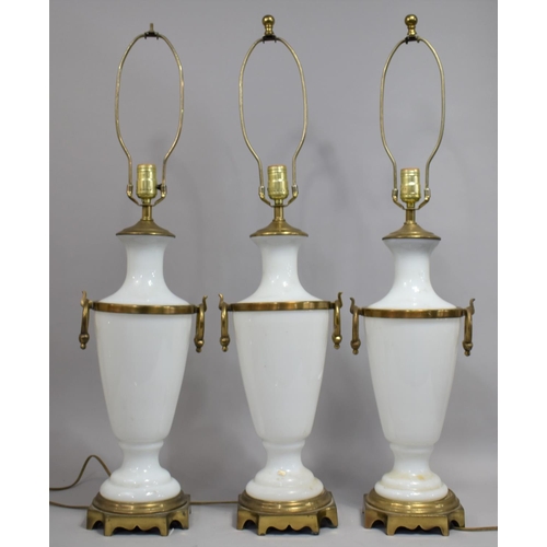 443 - A Set of Three Large Italian Opaque Glass and Ormolu Table Lamps of vase form with twin ring stylise... 