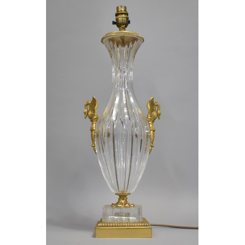 442 - A Cut Glass and Gilt Metal Mounted Table Lamp with twin swan handles, stepped base, 45cm high