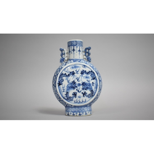 267 - A 19th Century Chinese Porcelain Moon Flask decorated with Dragons Chasing Flaming Pearl, 17cms High... 