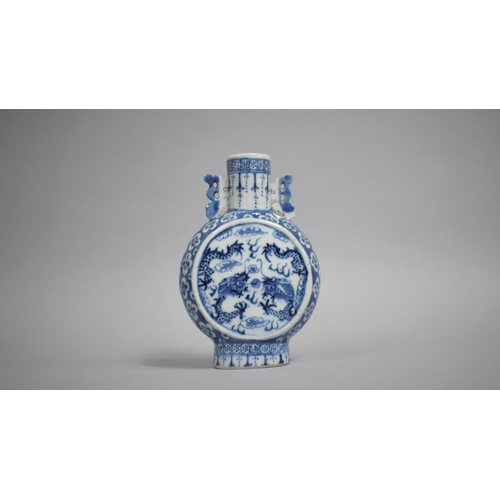 267 - A 19th Century Chinese Porcelain Moon Flask decorated with Dragons Chasing Flaming Pearl, 17cms High... 