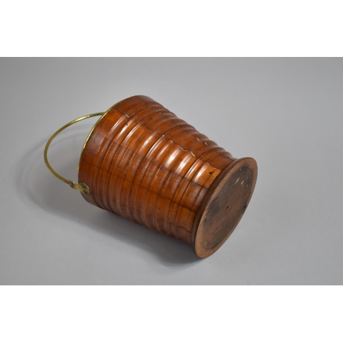 22 - A 19th Century Turned Wooden Bucket, of small proportions and of tapering form, brass handle and lin... 