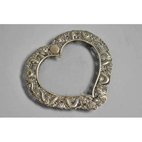 249 - A Chinese Silver Heart Shaped Photo Frame with Repousse decoration depicting Dragons Chasing Flaming... 