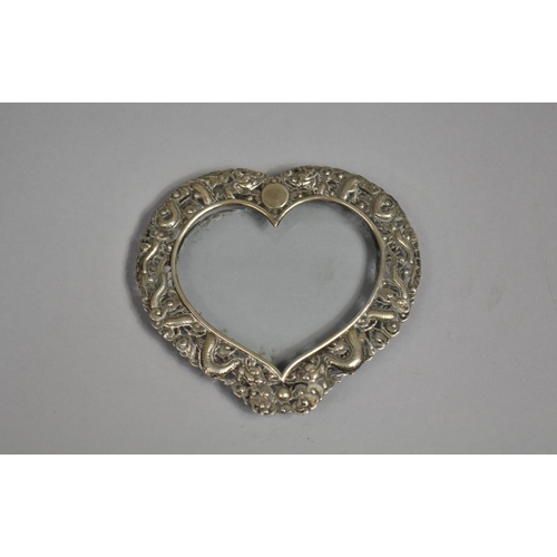 249 - A Chinese Silver Heart Shaped Photo Frame with Repousse decoration depicting Dragons Chasing Flaming... 