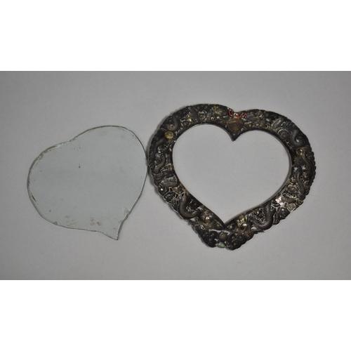 249 - A Chinese Silver Heart Shaped Photo Frame with Repousse decoration depicting Dragons Chasing Flaming... 