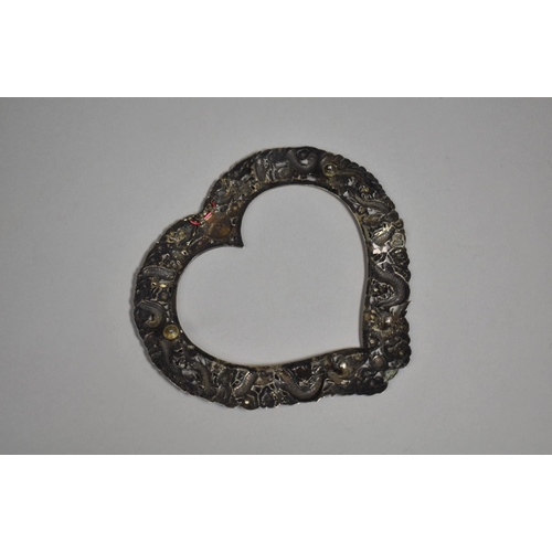 249 - A Chinese Silver Heart Shaped Photo Frame with Repousse decoration depicting Dragons Chasing Flaming... 