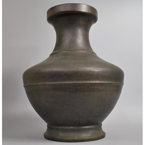 242 - A Large and Heavy Early Chinese Bronze Vase of Hu form, 50cm high