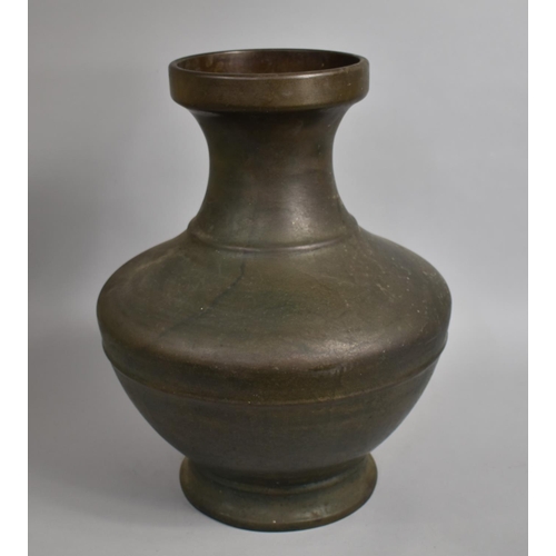 242 - A Large and Heavy Early Chinese Bronze Vase of Hu form, 50cm high