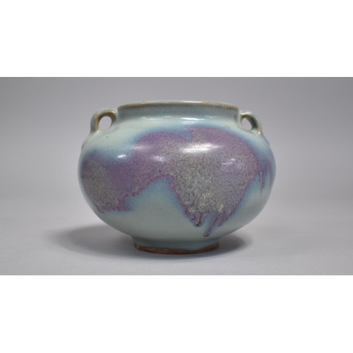 264 - A Chinese Jun Ware Splash Jar, Squat Bellied Form, with Twin Handles, Purple and Blue Glaze. 9.5cms ... 