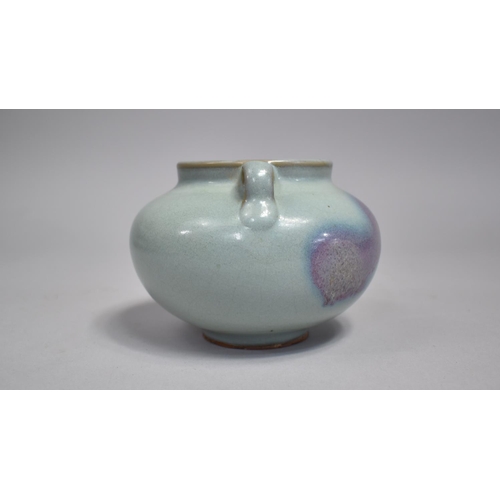 264 - A Chinese Jun Ware Splash Jar, Squat Bellied Form, with Twin Handles, Purple and Blue Glaze. 9.5cms ... 