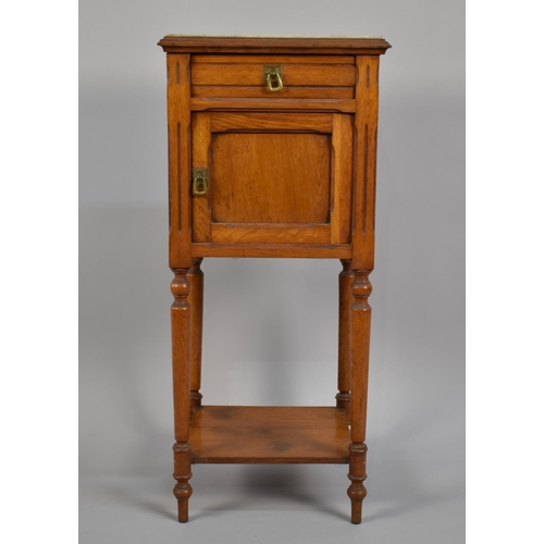 23 - A Late 19th Century Continental Oak Arts and Crafts Style Pot Cupboard with Inset Marble Top over a ... 