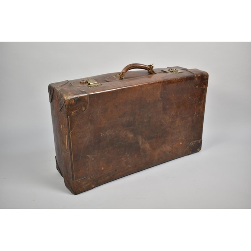 448 - A Large Early 20th Century Leather Suitcase, 45x22x76cms Long