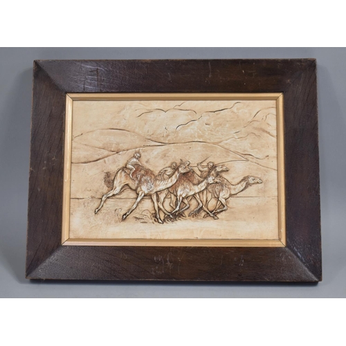 85 - An Early 20th Century Plaster Cast Panel of a Camel Race in an Solid Oak Swept Frame, 34x44cms