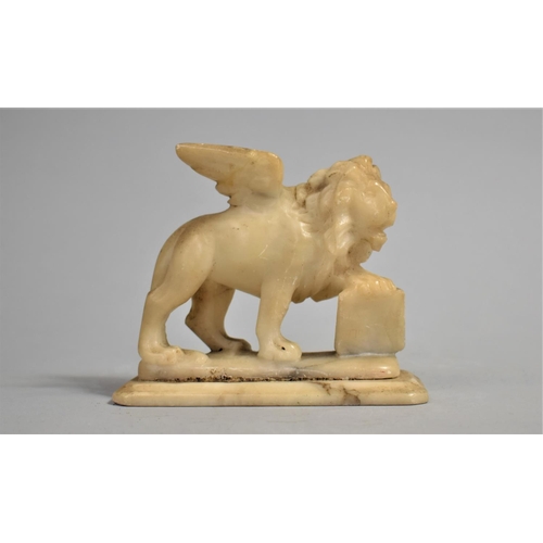 40 - A 19th Century Carved Alabaster Grand Tour Souvenir of the Lion of Saint Mark, 11cms Wide by 10cms H... 