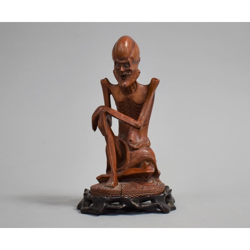 44 - A 19th Century Chinese Carved Boxwood Figure of an Emaciated Wise Man on a Hardwood Stand, 17cms Hig... 
