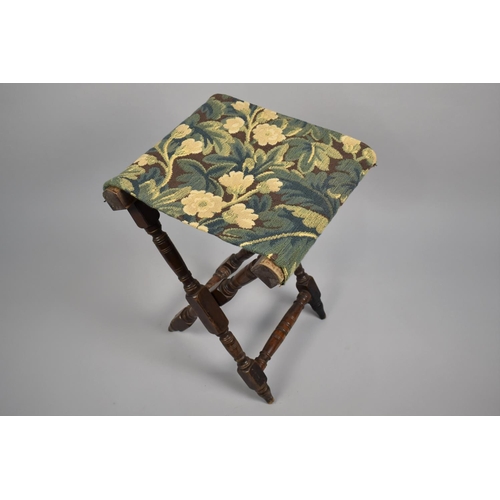 46 - A 19th Century Folding Campaign Stool with a Tapestry Seat, 57cms High