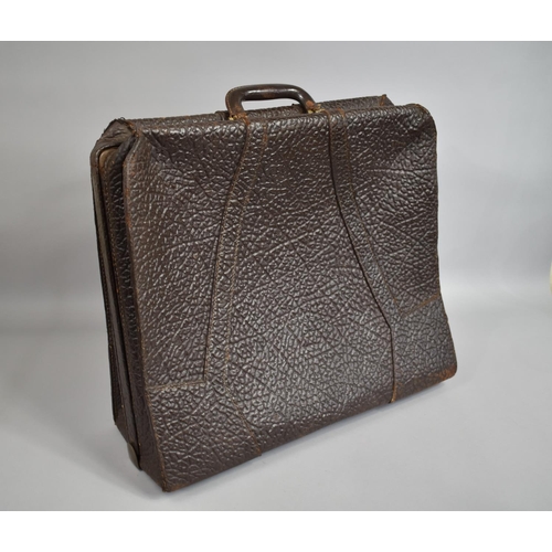 64 - A 1930's Elephant Hide Suitcase with Brass Fittings, 48x56cms Wide