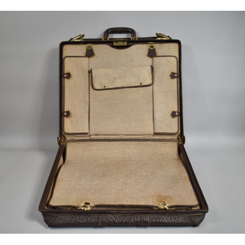 64 - A 1930's Elephant Hide Suitcase with Brass Fittings, 48x56cms Wide