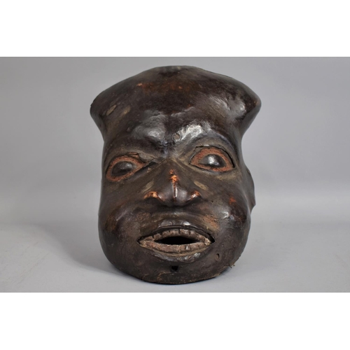 73 - A 19th Century Ekoi Headdress/Mask Modelled as an Oversized Human Head in Carved Wood Covered with P... 