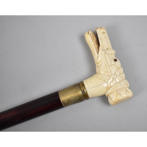 100 - A Reproduction Walking Cane with Carved Bone Handle in the Form of a Wolf's Head Wearing Spectacles ... 