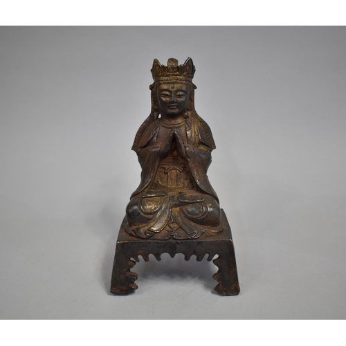 104 - A Far Eastern Bronze Study of Seated Buddha on Four Legged Throne, 21cms High