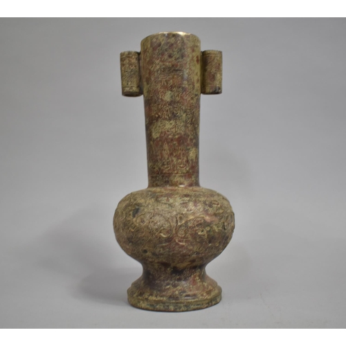 130 - A Chinese Bronze Vase of Archaic Form decorated in Relief, 28cms High