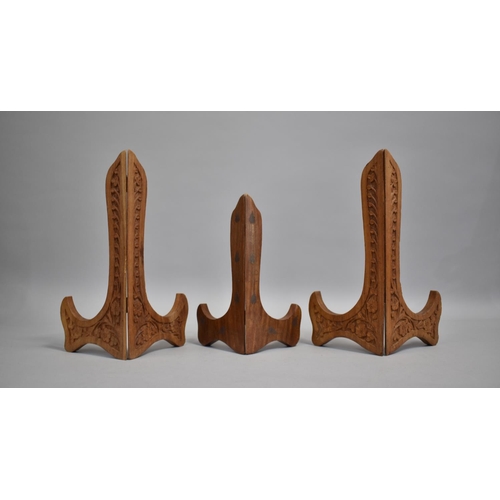 154 - Three Far Eastern Carved and inlaid Wooden Plate Stands, Largest 25cms