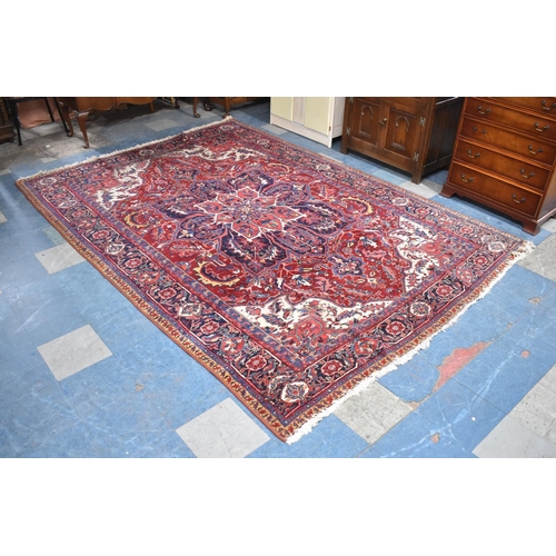 427 - A Persian Hand Made Heriz Carpet, 337x240cms