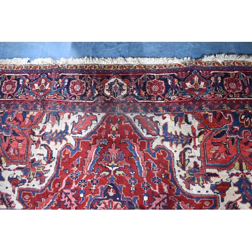 427 - A Persian Hand Made Heriz Carpet, 337x240cms