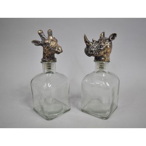 78 - A Pair of Novelty Spirit Decanters with Giraffe and Rhino Head Stoppers, 24cms High