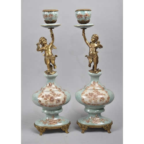 88 - A Pair of French Style Bronze and Porcelain Figural Candlesticks, Supports in the Form of Winged Che... 