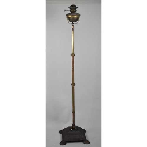 457 - A Victorian Cast Iron and Brass Oil Lamp Stand with Copper Oil Lamp, 141cm high