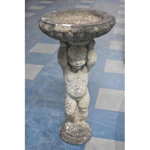 475 - A Reconstituted Stone Garden Bird Bath with Cherub Support, 75cms High