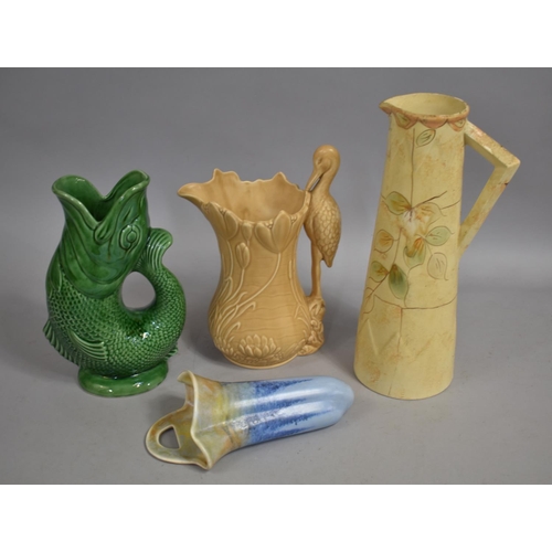 285 - A Green Glazed Gluggle Jug, Sylvac Heron Jug (1960), Stafford Ewer Type Jug and a Glazed Wall Pocket