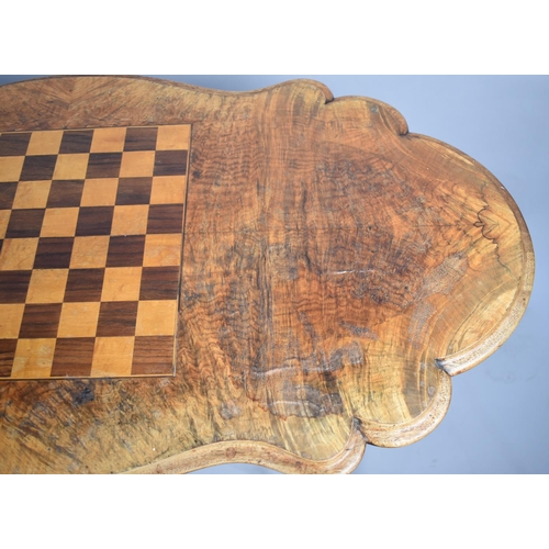 81 - A Victorian Inlaid Walnut Games Table with Chess Board Top, Turned Supports and Scrolled Feet, Water... 