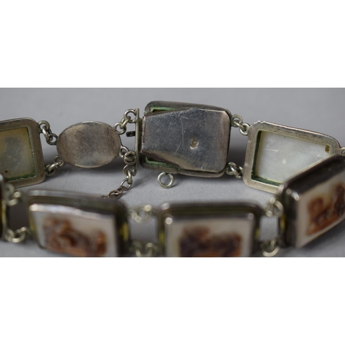 387 - A Vintage Italian Seven Panel Sectional Bracelet (Stamped 900) Having Mother of Pearl Panels Decorat... 