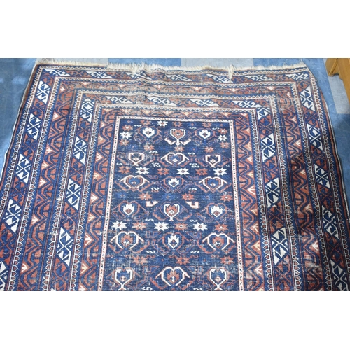 475 - A Vintage Patterned Woollen Rug, 150x116cm