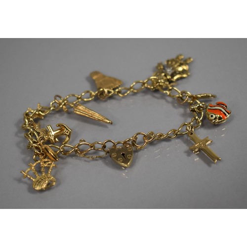 58 - A 9ct Gold Charm Bracelet, Having Eight Gold and Gold Coloured Metal Charms to include Bagpipes, Umb... 