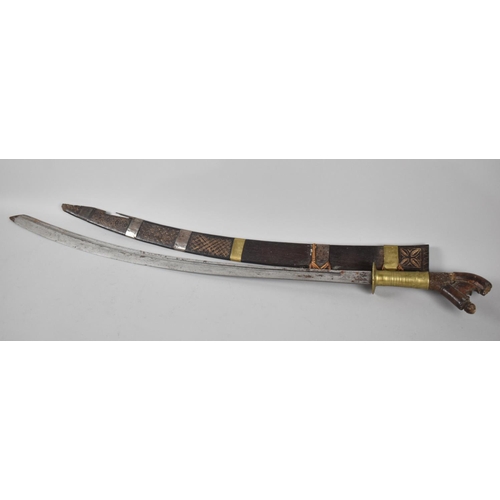 100 - An Indonesian Klewang with Curved Blade, Brass Grip and Brass Mounted Scabbard (AF), Late 19th/Early... 