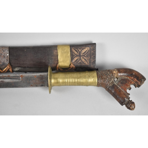 100 - An Indonesian Klewang with Curved Blade, Brass Grip and Brass Mounted Scabbard (AF), Late 19th/Early... 