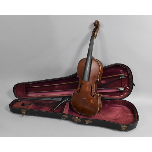 175 - A Cased Violin with Two Bows, In need of Substantial Restoration and Repair