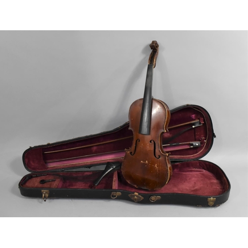 175 - A Cased Violin with Two Bows, In need of Substantial Restoration and Repair