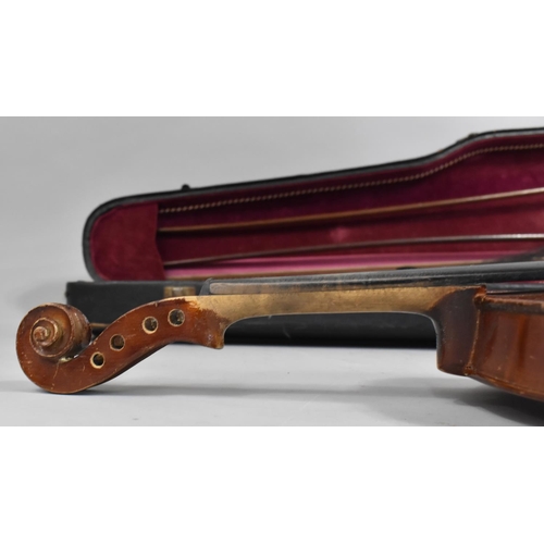 175 - A Cased Violin with Two Bows, In need of Substantial Restoration and Repair